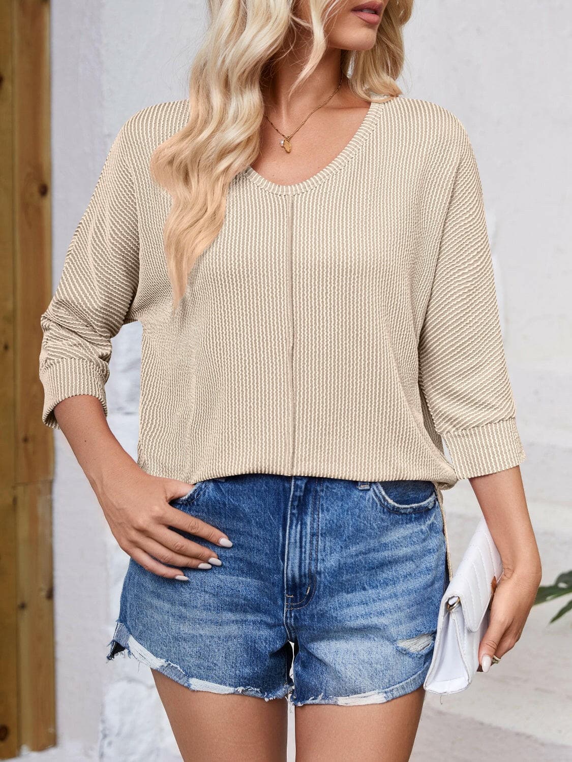 Textured Round Neck Three-Quarter Sleeve Blouse.