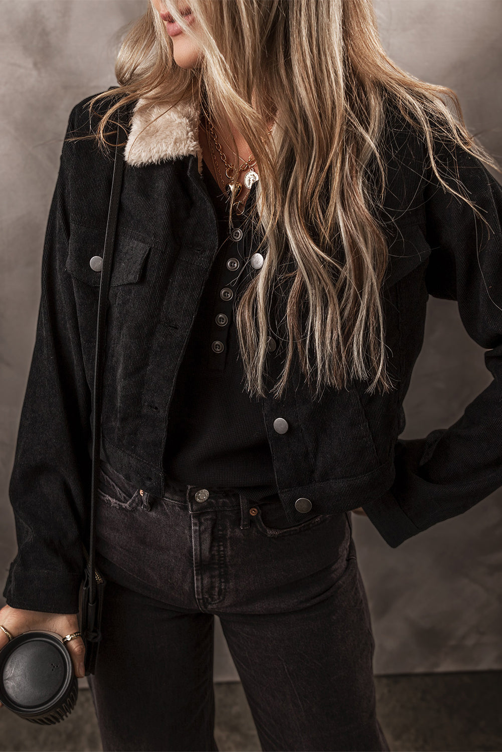 Cozy black corduroy crop jacket with fleece lining and button-up closure