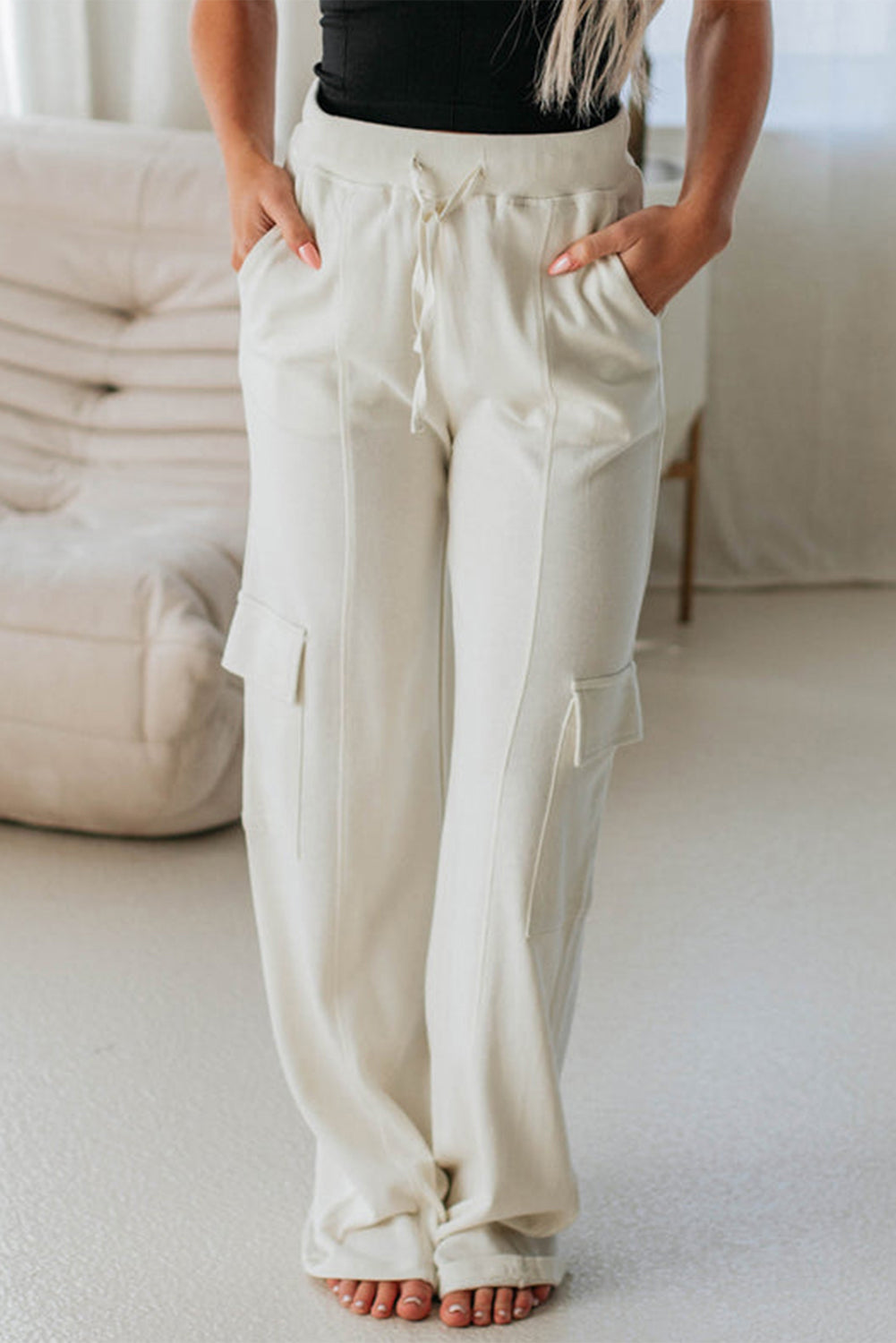 Beige high-waisted cargo sweatpants with pockets for casual comfort