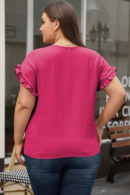 Playful pink ruffled short sleeve top for plus sizes