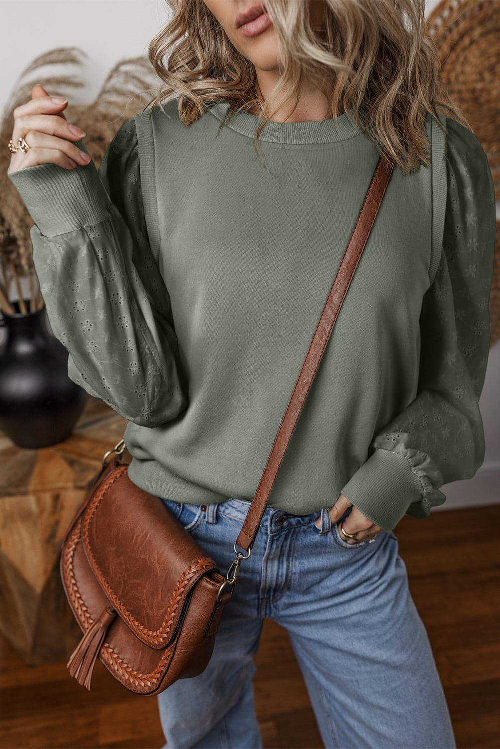 Eyelet Round Neck Long Sleeve Sweatshirt.