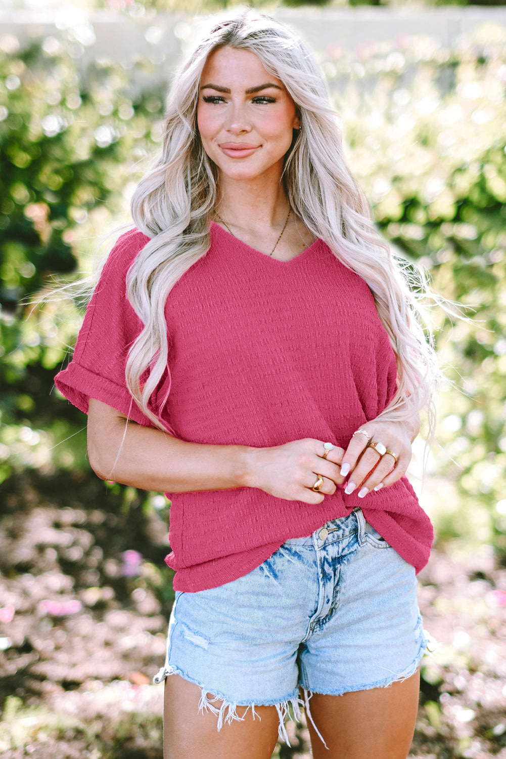 Chic bright pink rolled sleeve V neck tee for effortless style