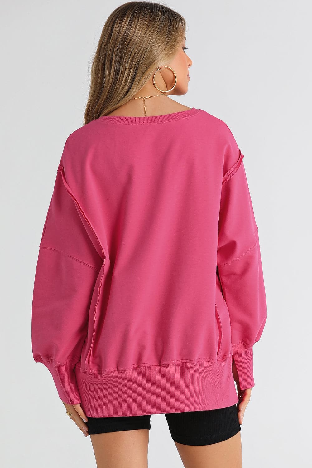 Slit Exposed Seam Round Neck Sweatshirt.