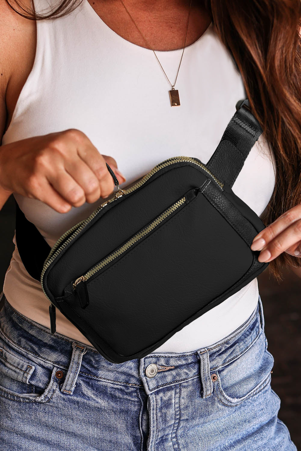 Sleek black crossbody bag with multiple zip compartments