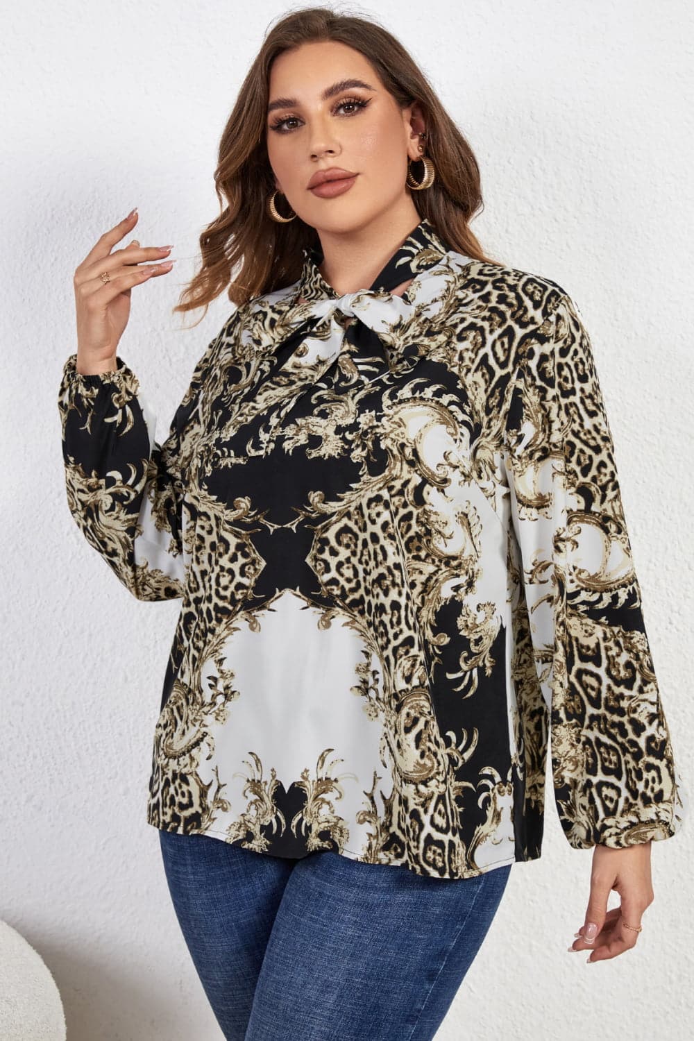 Melo Apparel Plus Size Printed Tie Neck Long Sleeve Blouse.