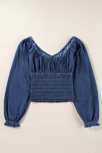 Chic dark blue ruffled puff sleeve denim blouse with smocked details