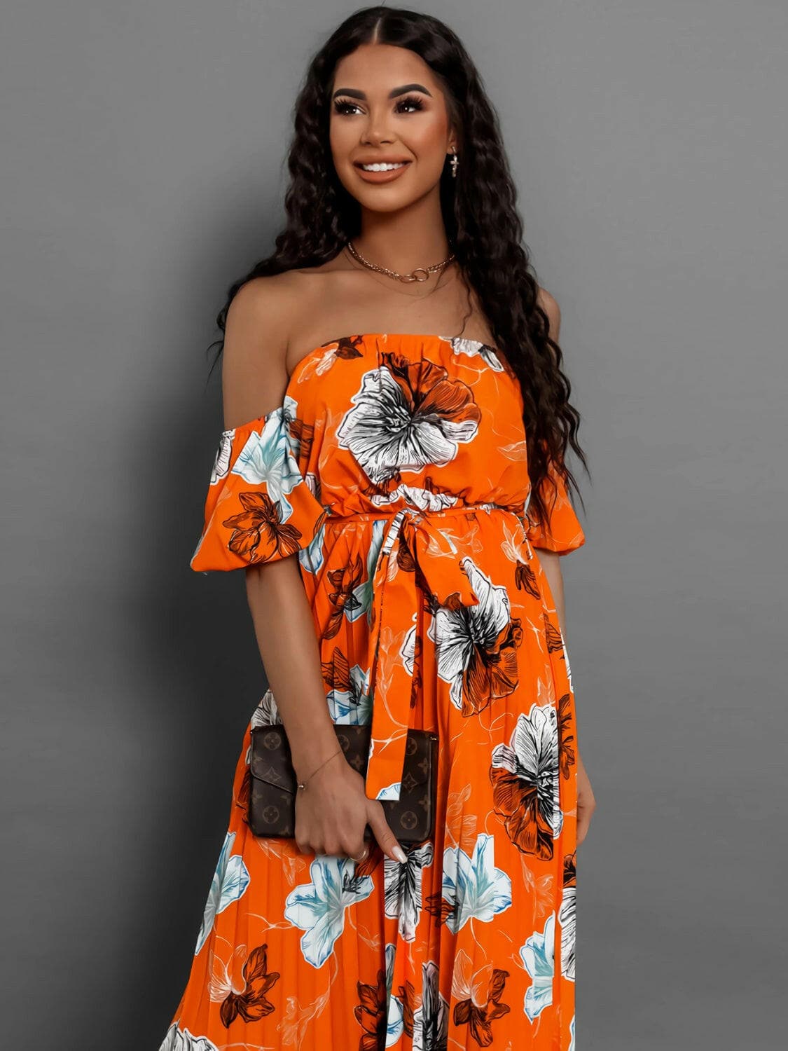 Pleated Floral Off-Shoulder Short Sleeve Midi DressPleated Floral Off-Shoulder Short Sleeve Midi Dress
 Step into elegance with our Pleated Floral Off-Shoulder Short Sleeve Midi Dress. Embrace sophistication effortleLove Salve -Shoulder Short Sleeve Midi Dressjust arrived