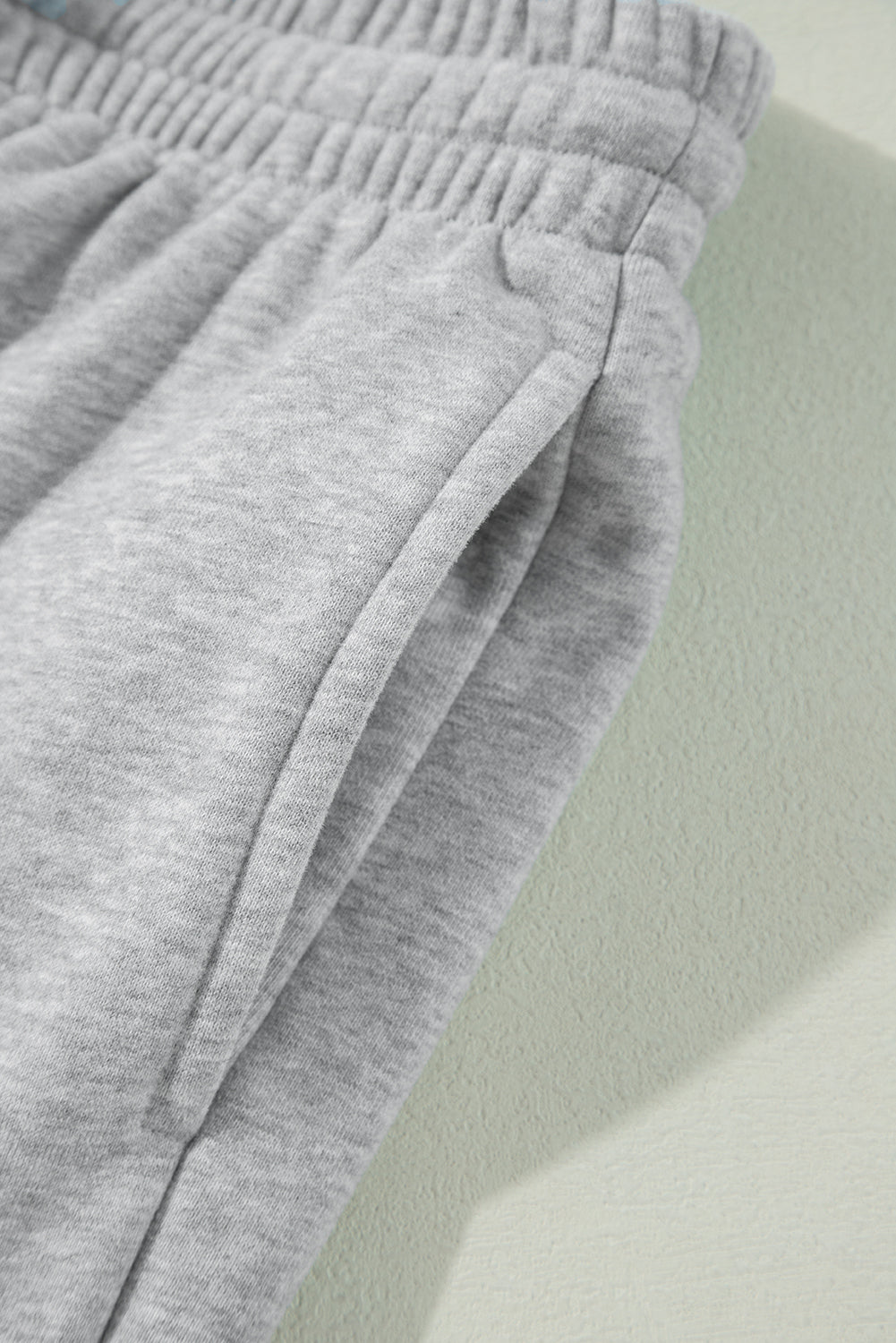 Cozy light grey fleece-lined joggers with adjustable drawstring waist