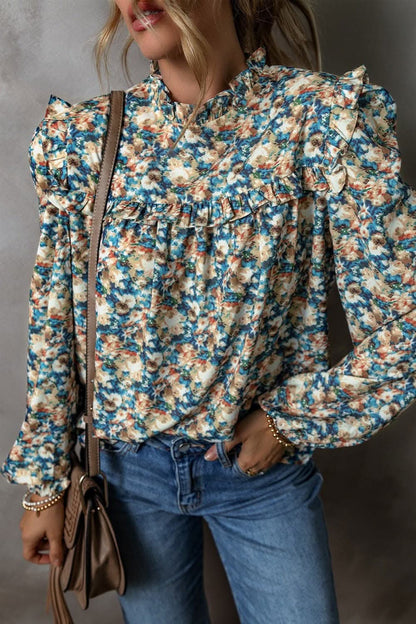 Frill mock neck long sleeve blouse with floral print and delicate frill accents.