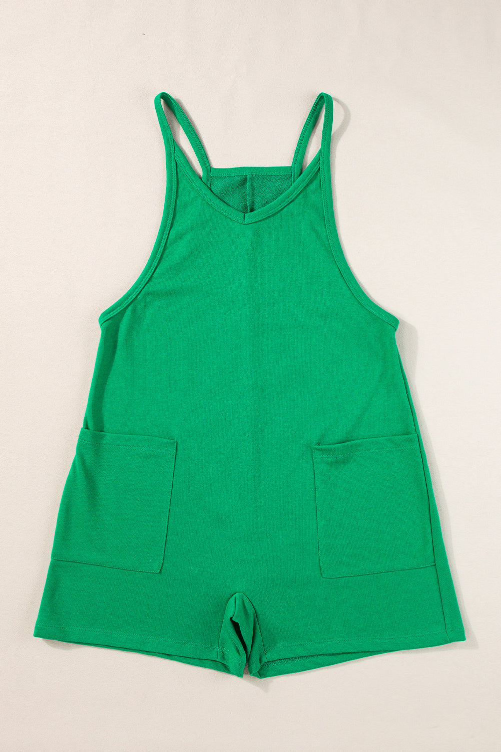 Vibrant green sleeveless v-neck romper with pockets