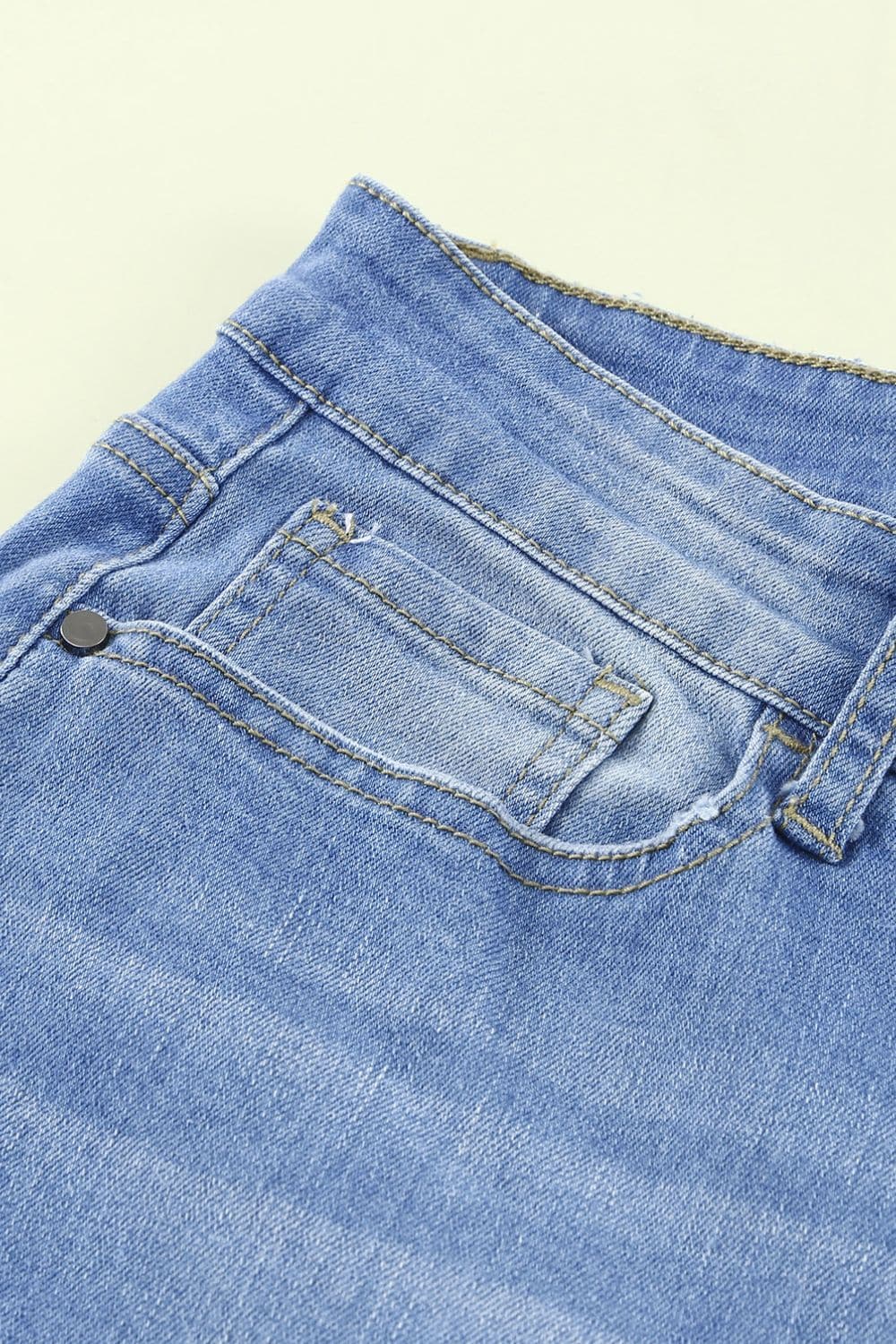 Button-Fly Distressed Raw Hem Flare Jeans.