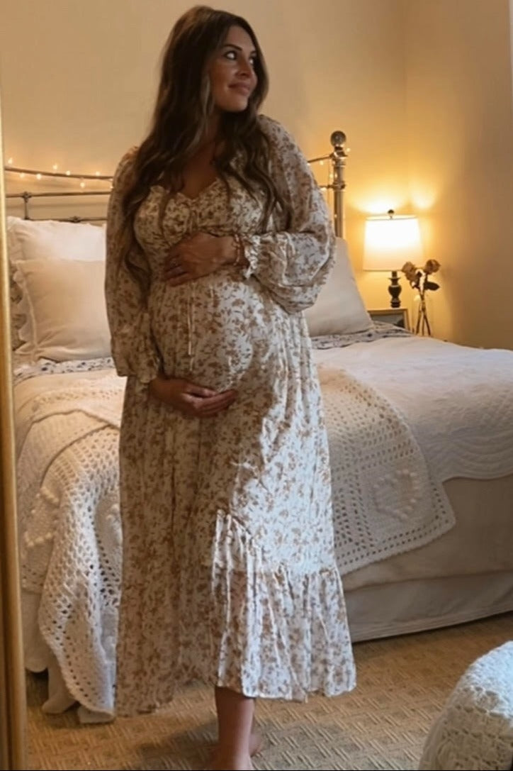 PinkBlush Ivory Floral Chiffon Ruffle Maternity Maxi Dress, showcasing the comfortable fit for a growing bump.
