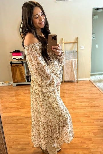 PinkBlush Ivory Floral Chiffon Ruffle Maternity Maxi Dress, close-up of the elegant ruffle trim on the flowing skirt.
