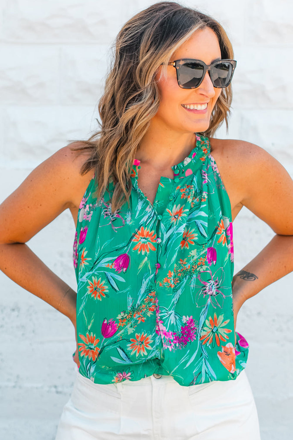 Floral charm: Bright green halter neck tank top with buttoned detail