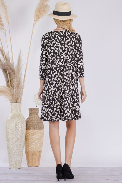 Celeste Full Size Leopard Three-Quarter Sleeve Dress with Pockets.