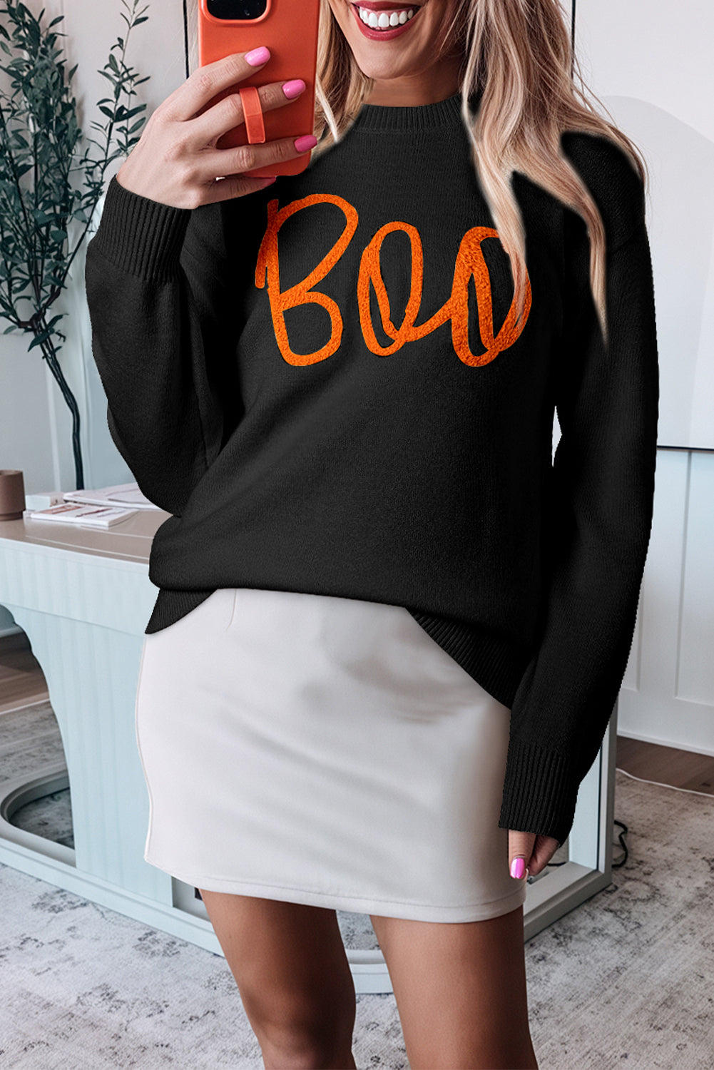 Cozy black "Boo" knitted sweater with ribbed edges for casual style