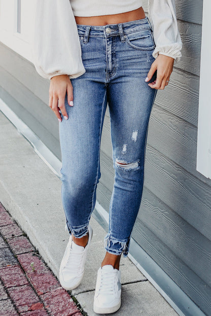 Retro light blue frayed ankle skinny jeans with a distressed finish