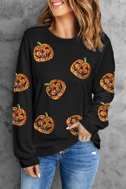 Sparkling pumpkin face pullover for a spooky Halloween look