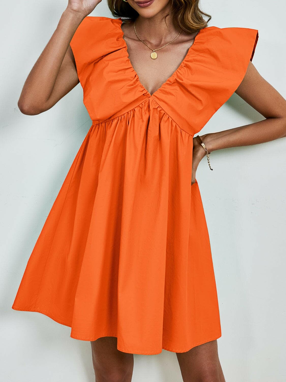 V-Neck Cap Sleeve Mini DressUpgrade Your Style with Our V-Neck Cap Sleeve Mini Dress
 Step out in confidence and elegance with our V-Neck Cap Sleeve Mini Dress, a versatile piece that effortlesLove Salve -Neck Cap Sleeve Mini Dress