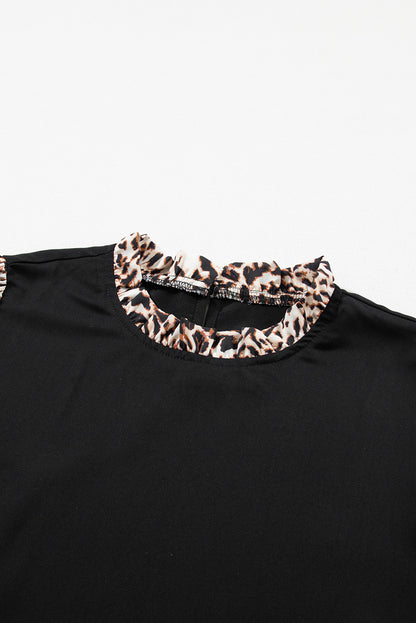 Elegant black lantern sleeve blouse with leopard print accents