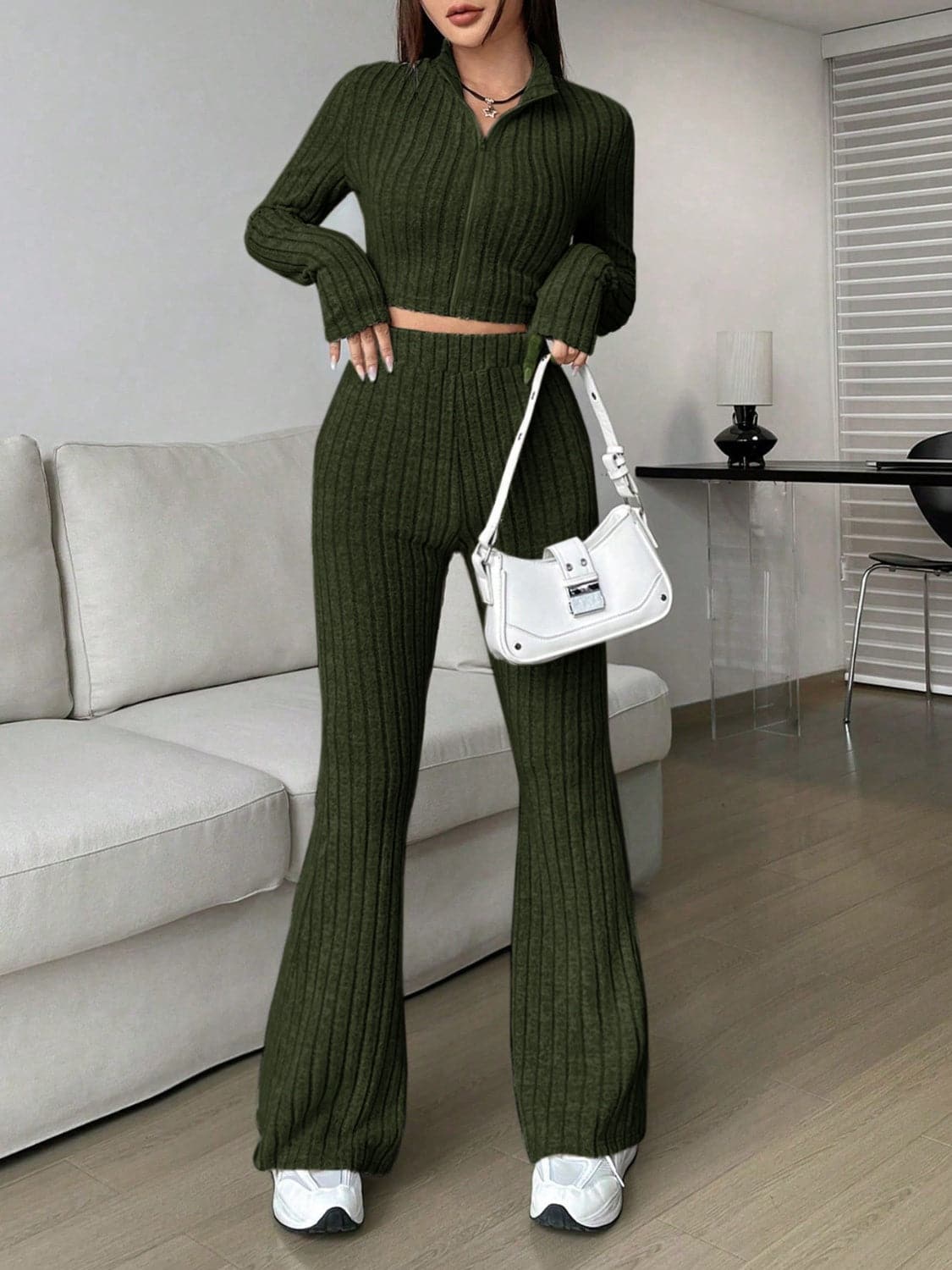 Zip Up Long Sleeve Top and Pants SetFeatures: Basic style
Number of pieces: Two-piece
Stretch: Slightly stretchy
Material composition: 95% polyester, 5% elastane
Care instructions: Machine wash cold. TLove Salve Long Sleeve TopTwo-Piece Sets