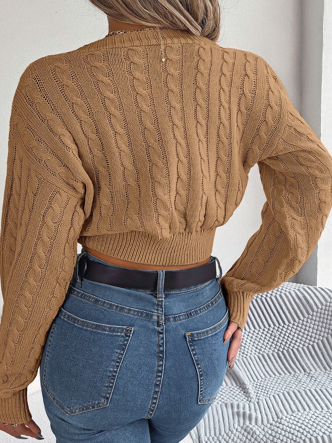 Twisted Cable-Knit V-Neck Sweater.