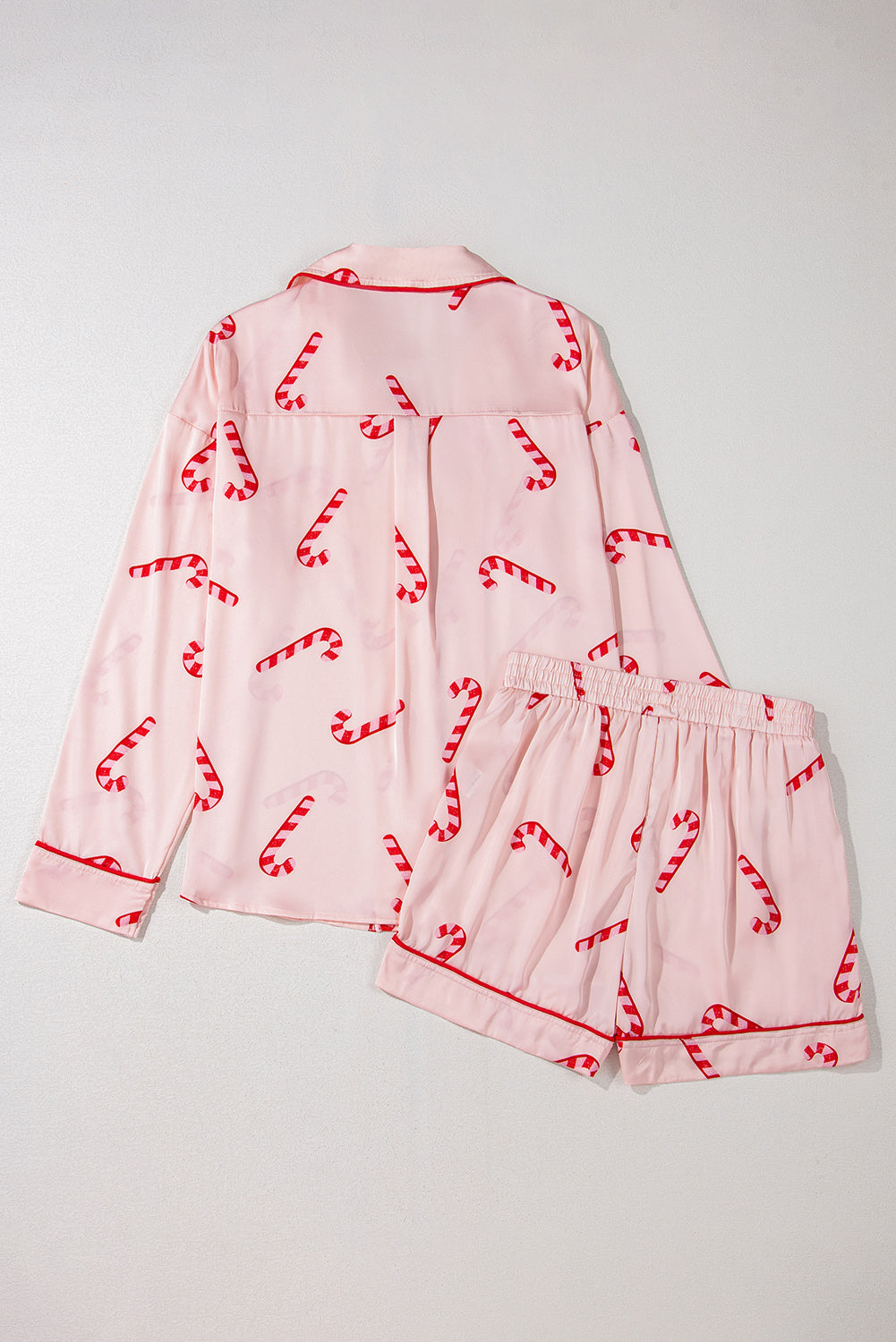 Pink candy cane print holiday pajama set with shirt and shorts