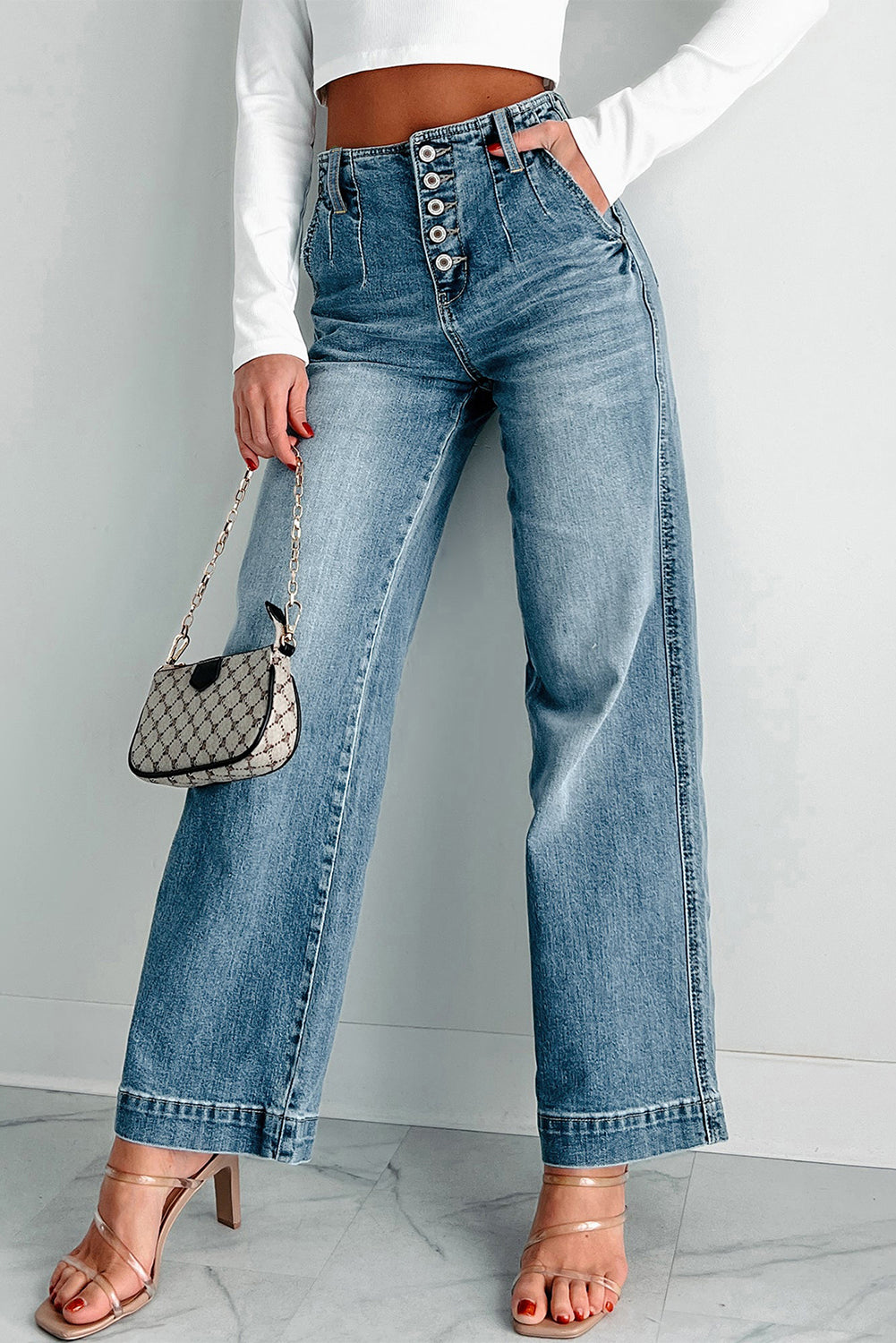 Dusk blue high-waisted loose leg jeans with unique button details