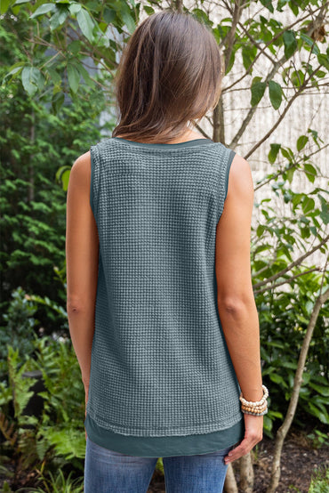 Teal flowy vest with scoop neckline and waffle knit texture