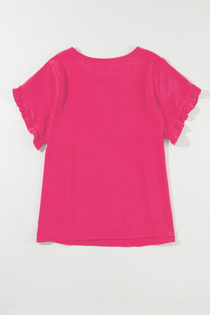 Playful pink ruffled short sleeve top for plus sizes