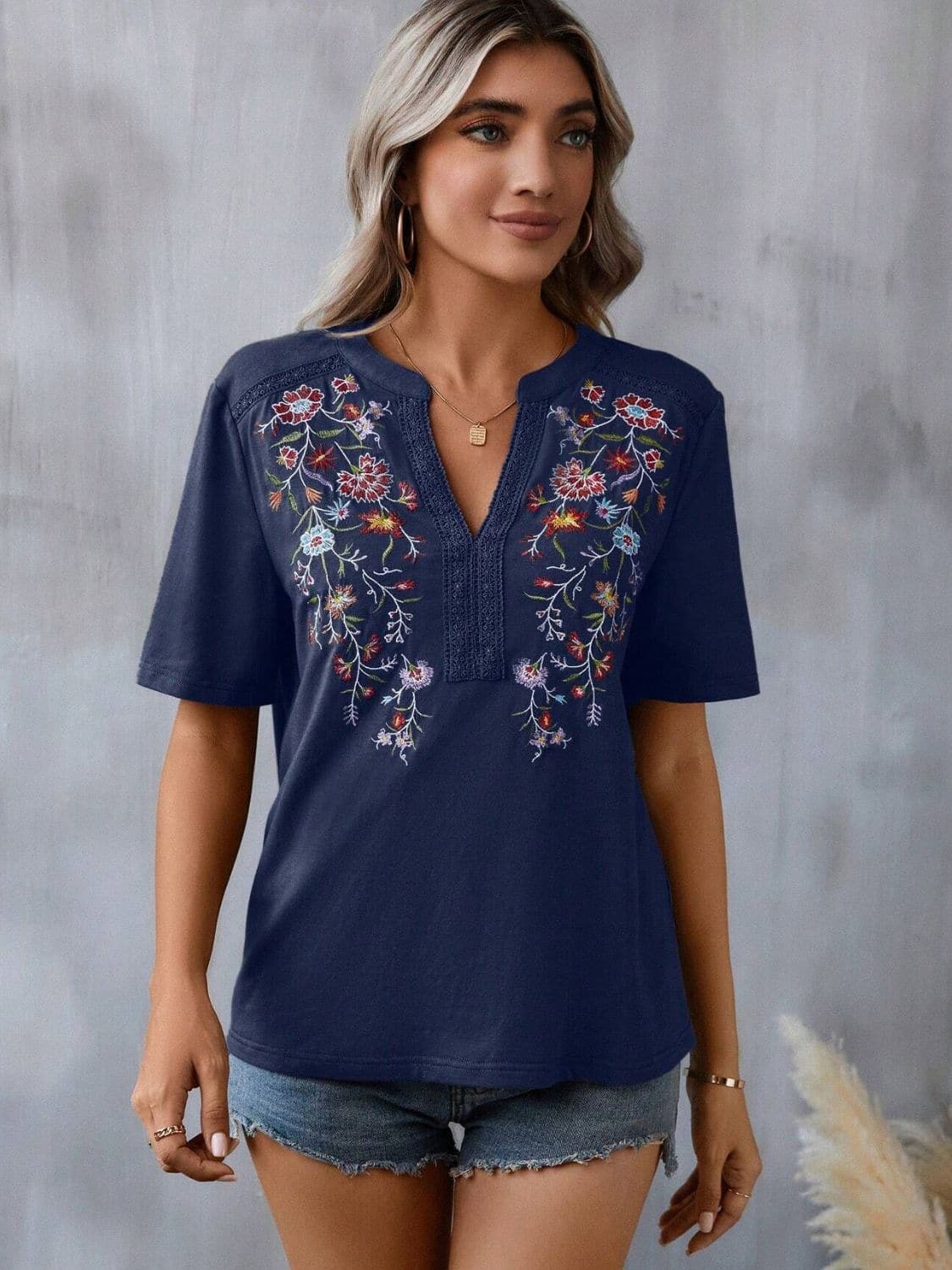 Embroidered Notched Short Sleeve T-Shirt.