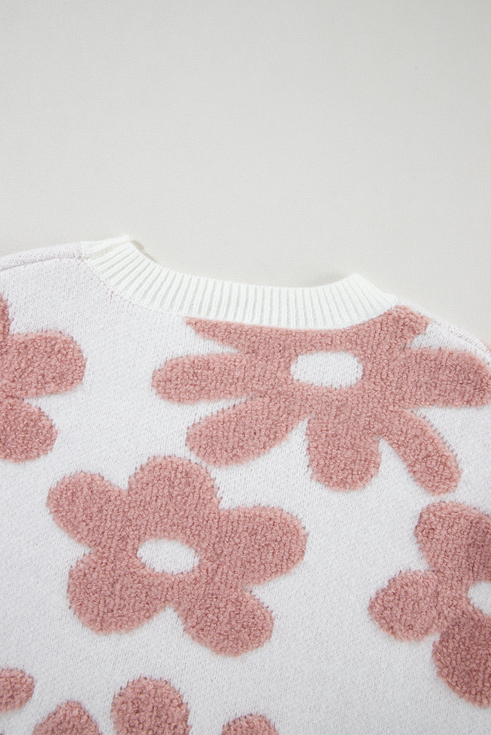 Floral-inspired white drop shoulder sweater for relaxed winter vibes