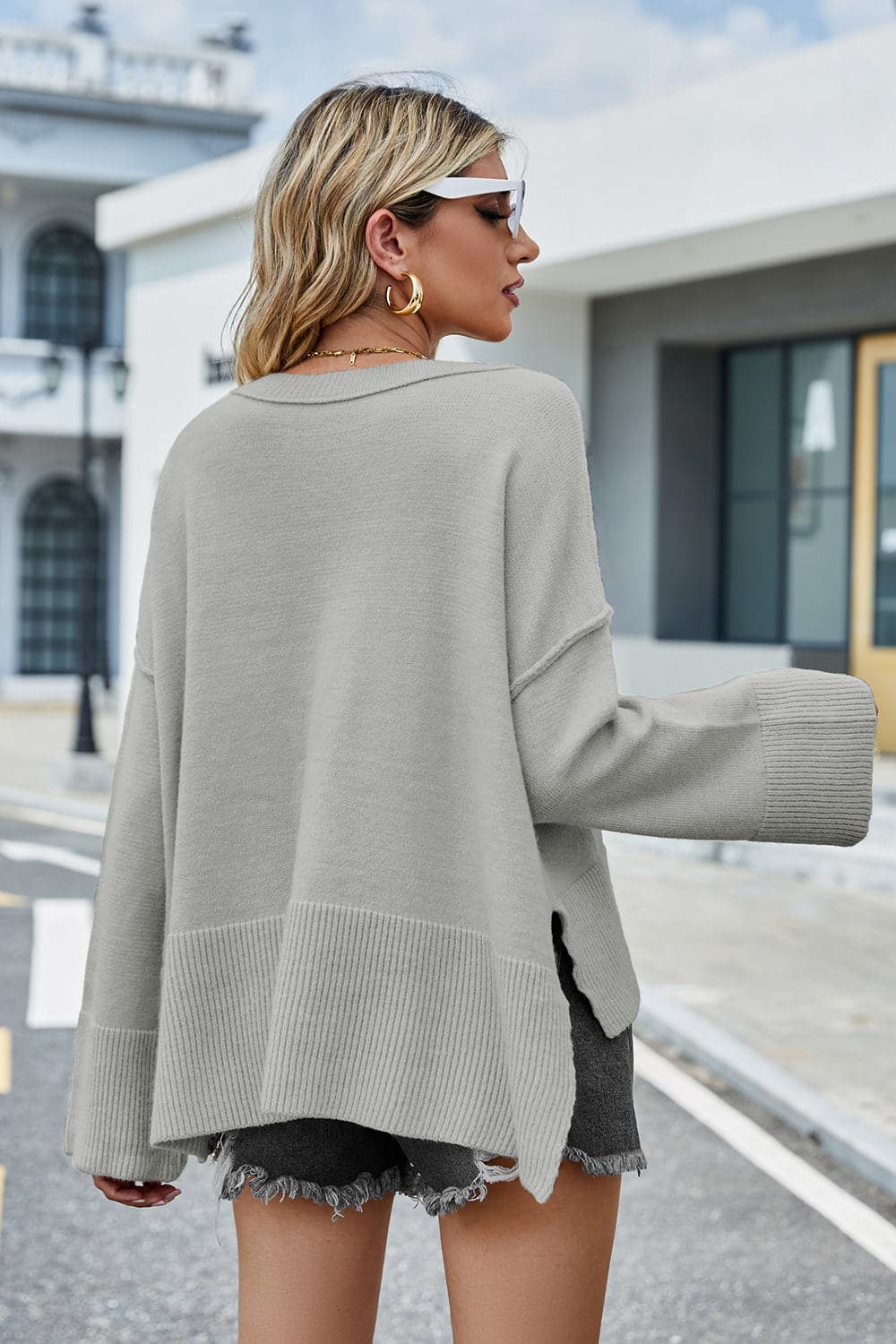 High-Low Slit Round Neck Long Sleeve Sweater.