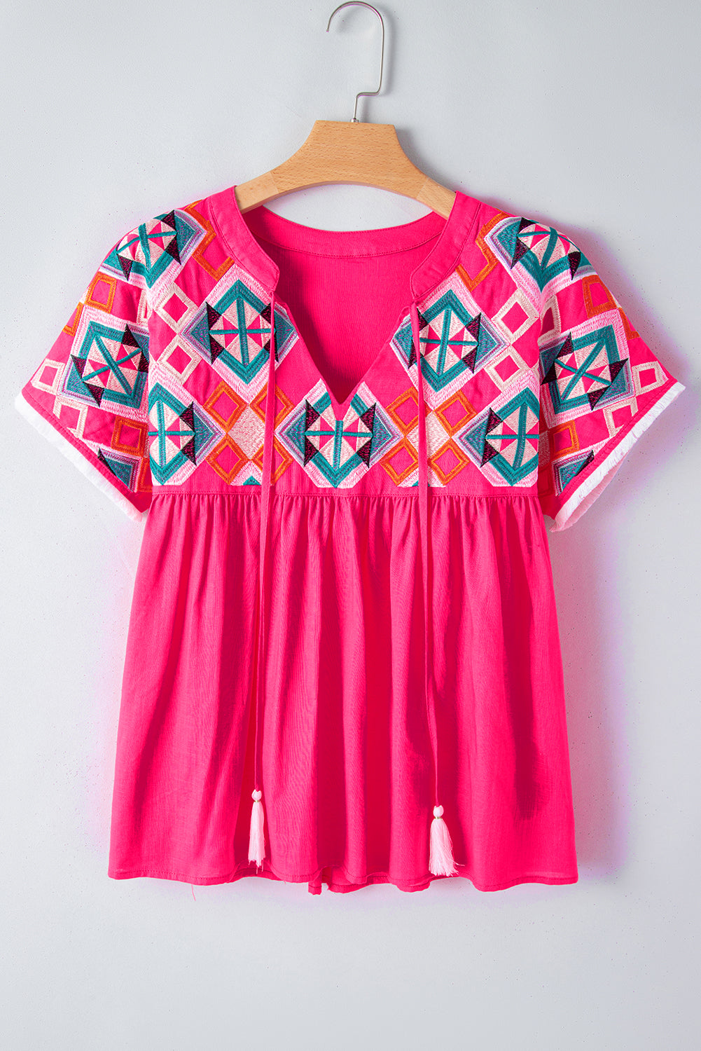 Chic strawberry pink geometric embroidered blouse with tassel tie neckline