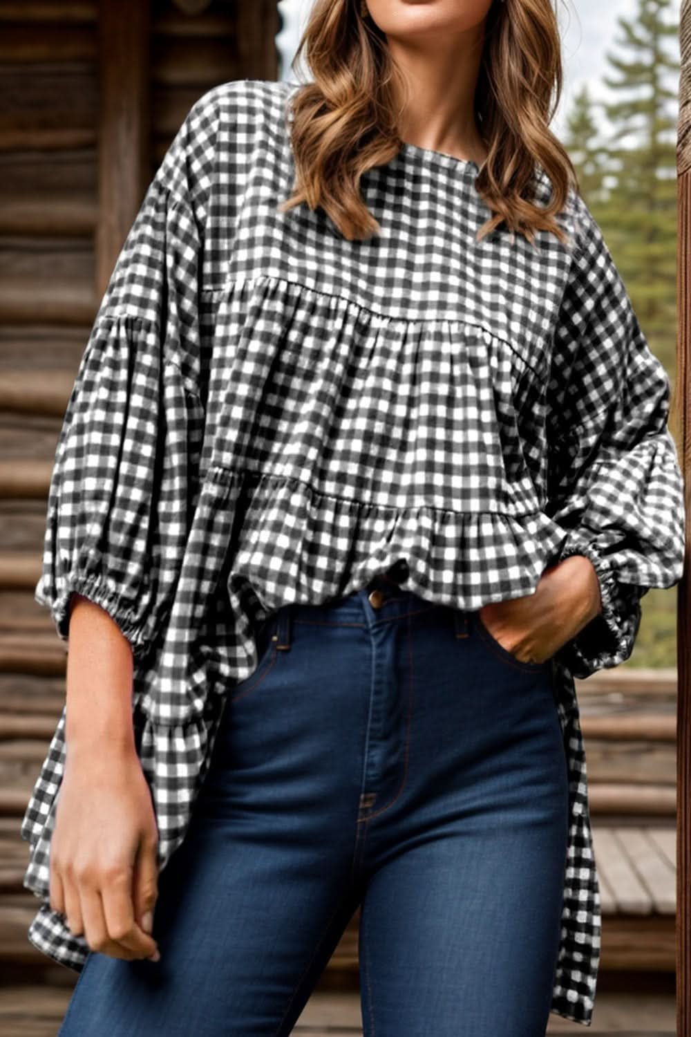 Tiered plaid round neck long sleeve blouse with elegant design.