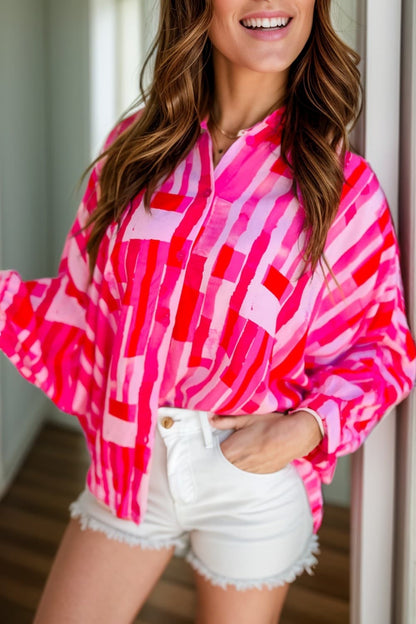 Chic color block long sleeve shirt in vibrant pink pattern.