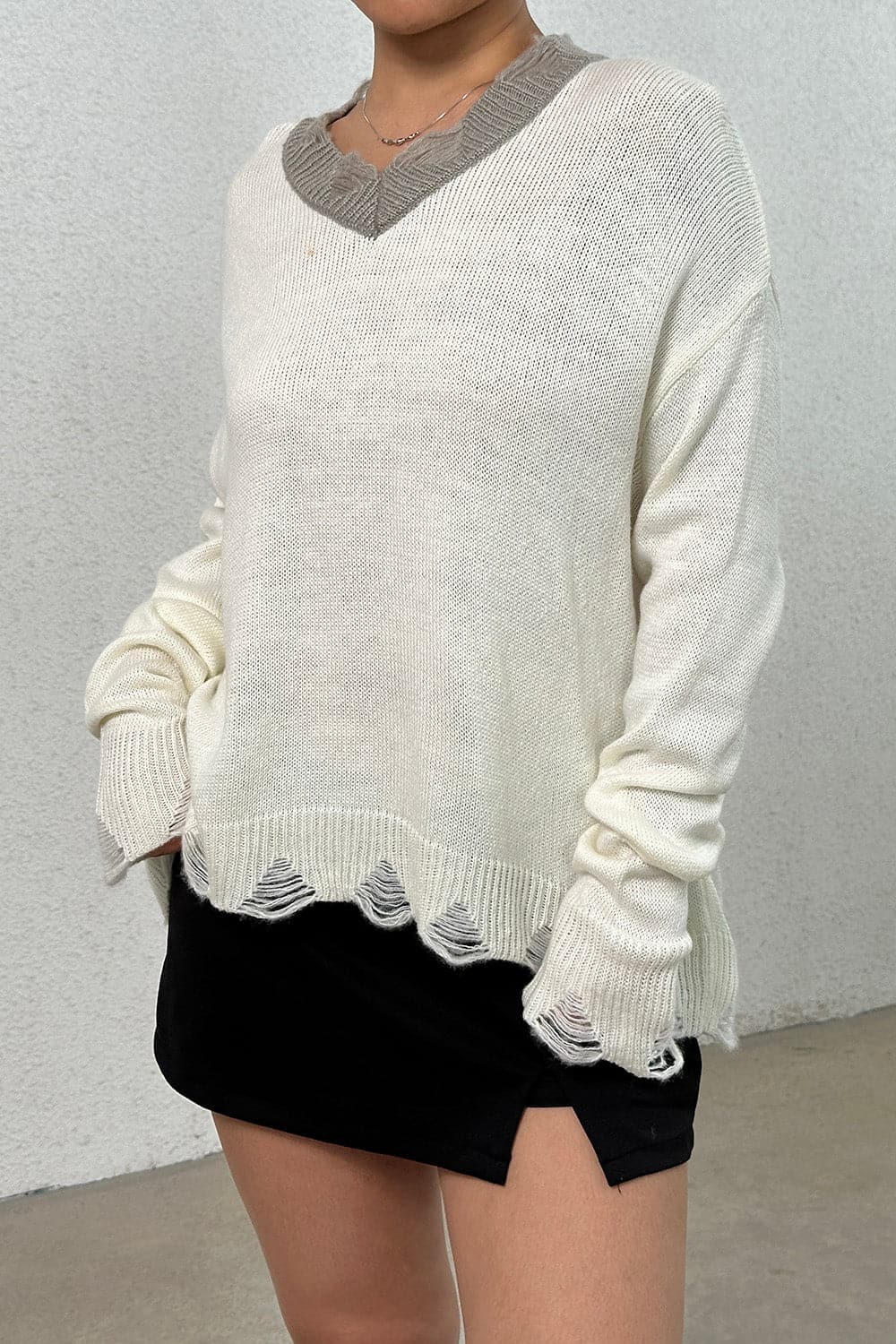 Distressed V-Neck Dropped Shoulder Sweater.