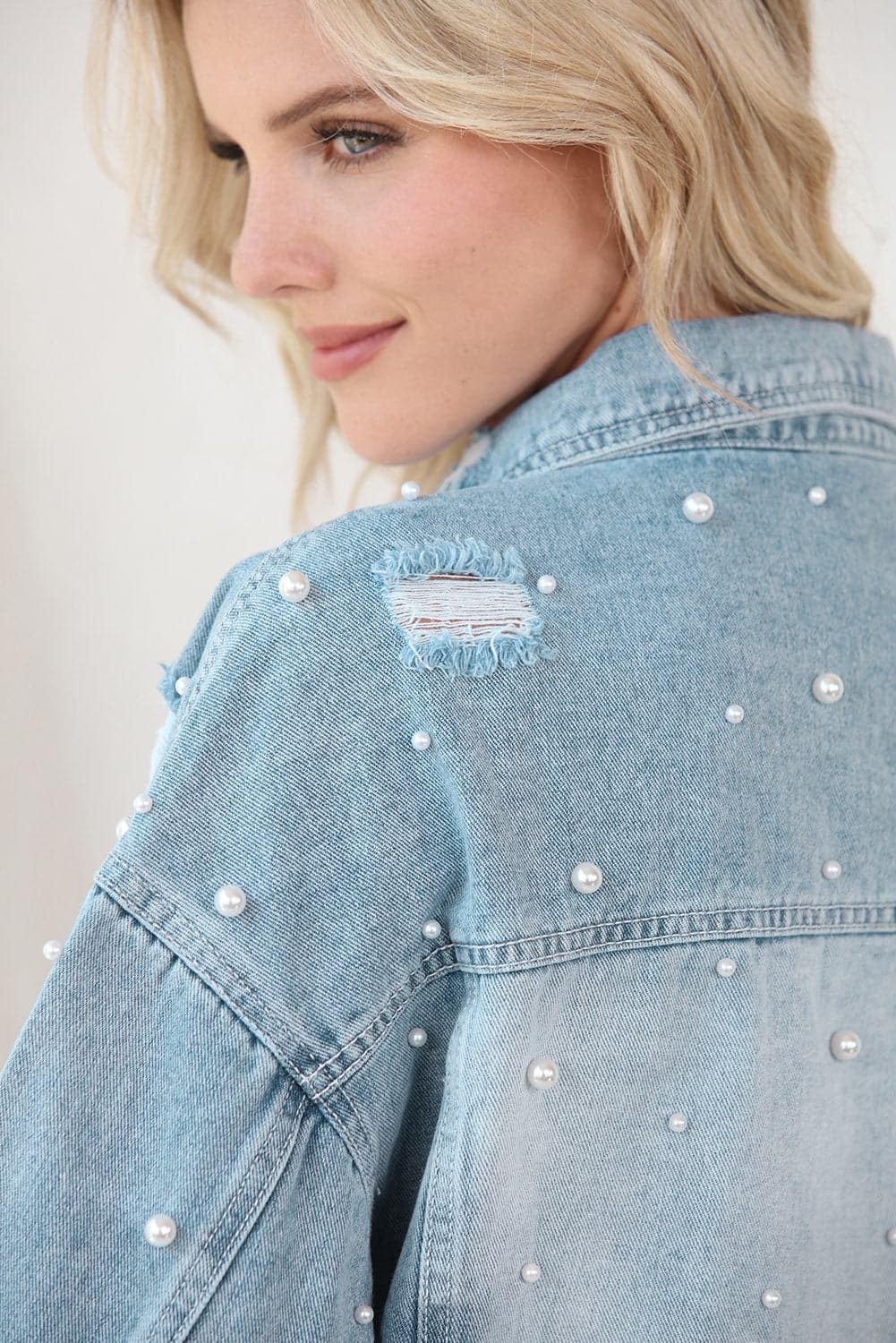 Distressed Pearl Trim Button Up Denim Jacket.