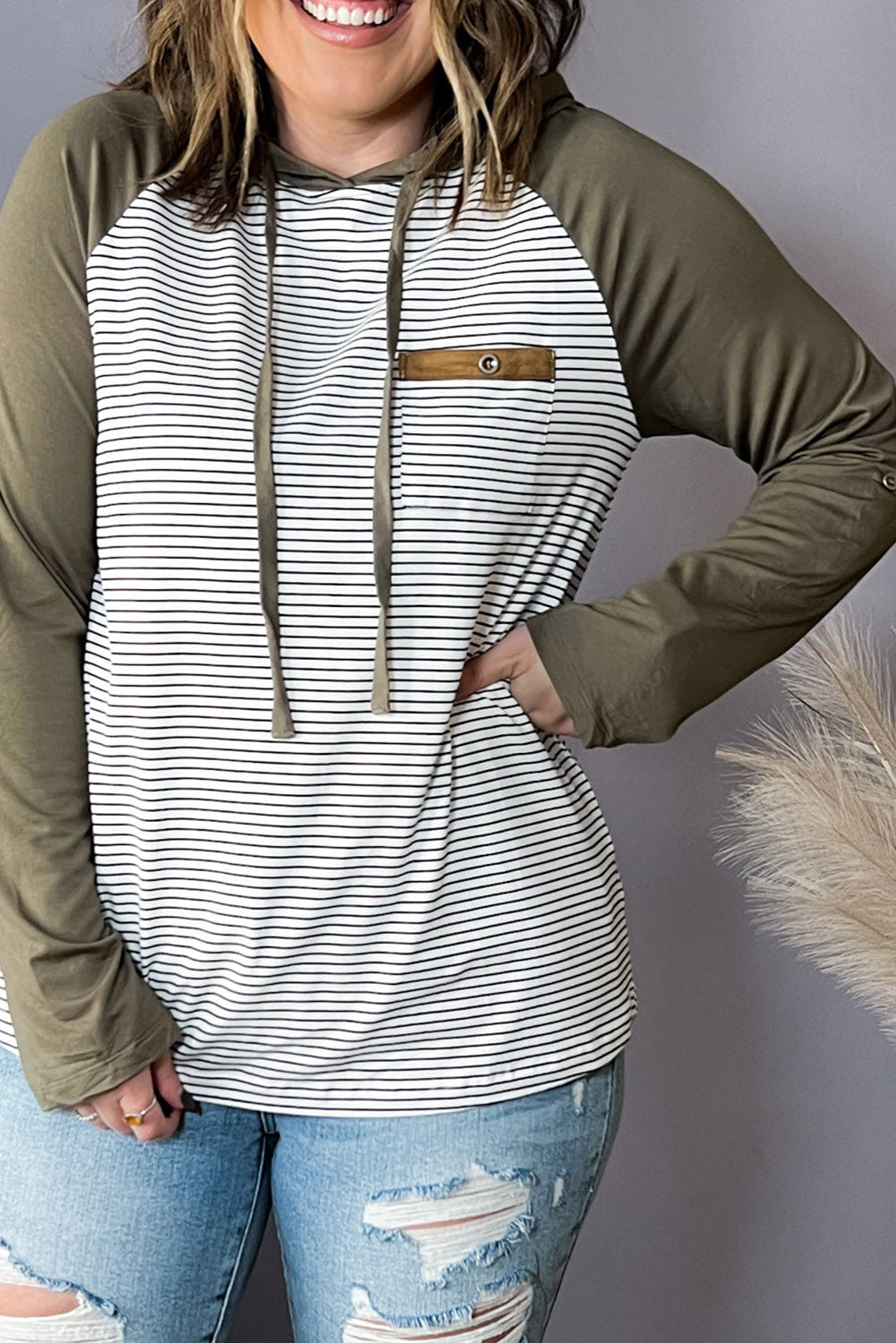 Green striped plus size hoodie with raglan sleeves and buttoned pocket