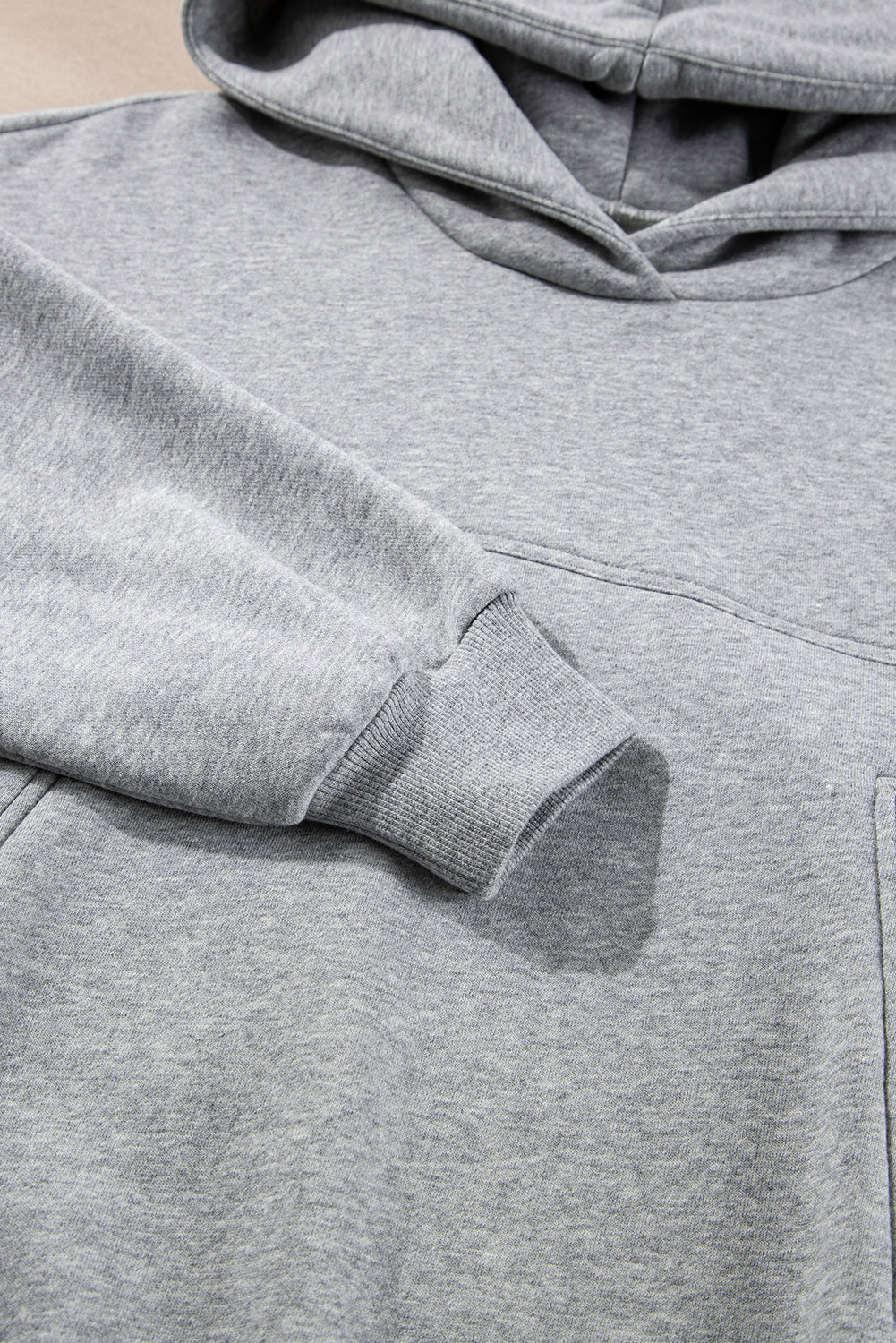 Stylish gray hoodie and joggers set with exposed seams