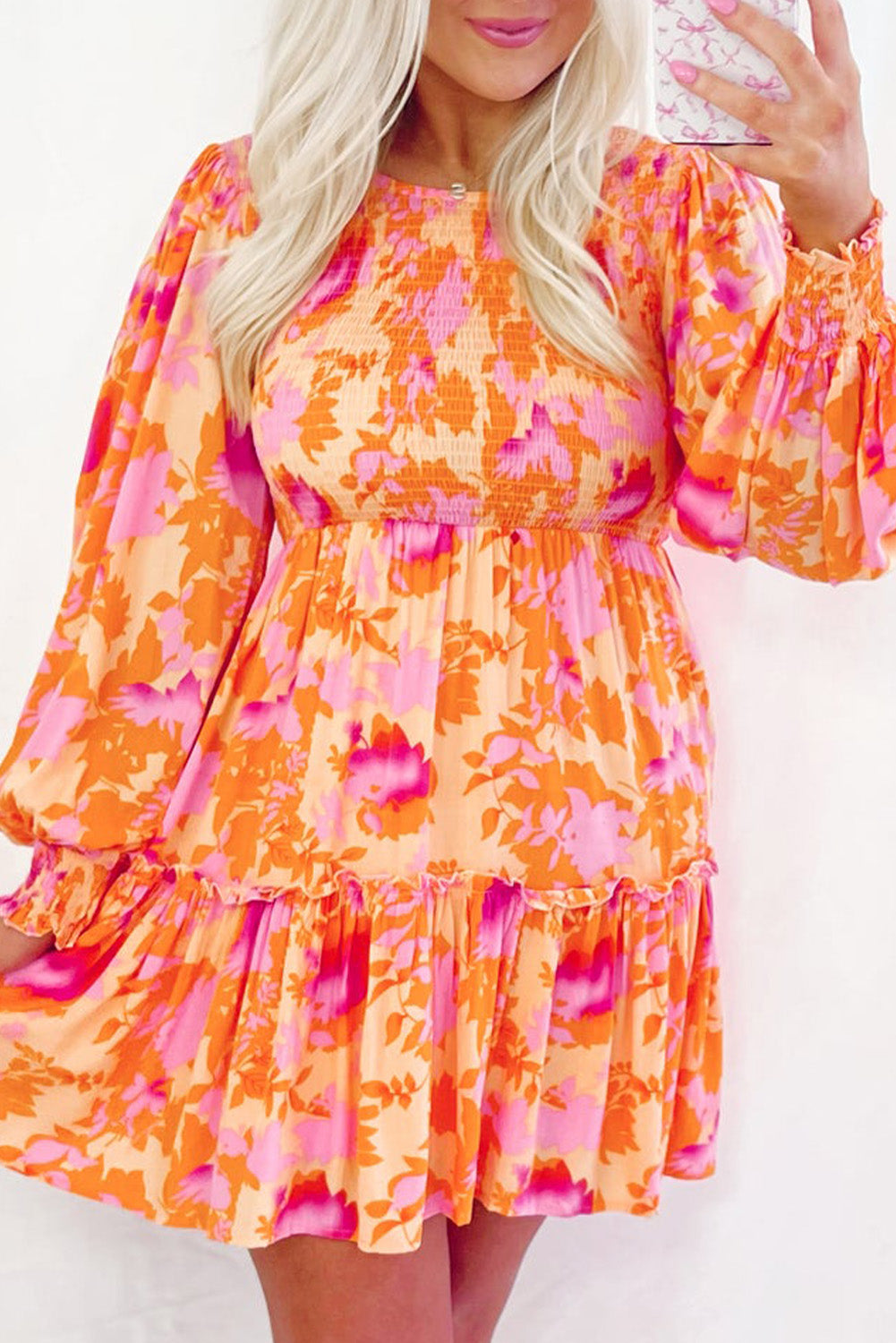 Eye-catching orange abstract smocked mini dress with ruffled lantern sleeves