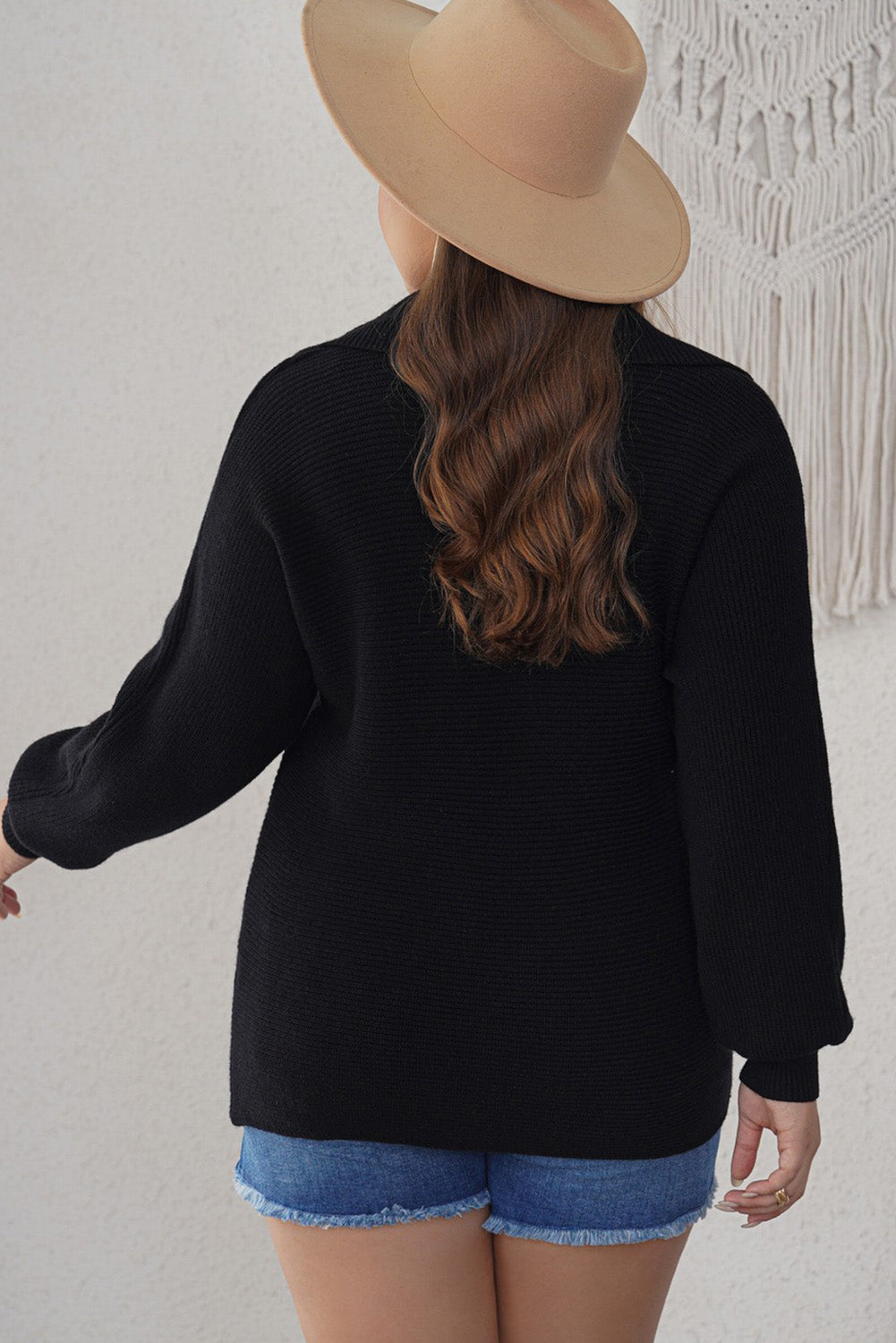 Curvy elegance: Black ribbed knit lapel sweater