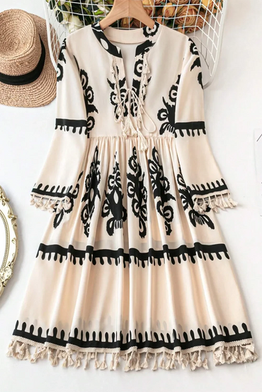 Bohemian tassel mini dress with three-quarter sleeves