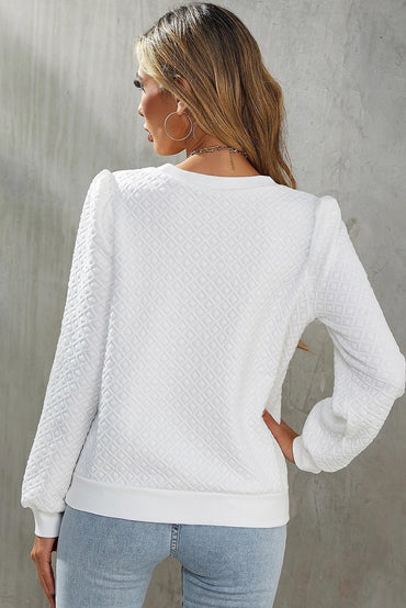 Chic white textured puff sleeve top with round neckline