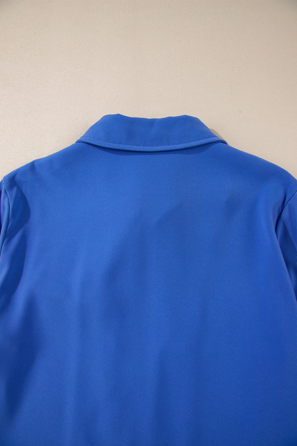 Dusk Blue Zip-Up Jacket with Tab Sleeves and Flap Detail