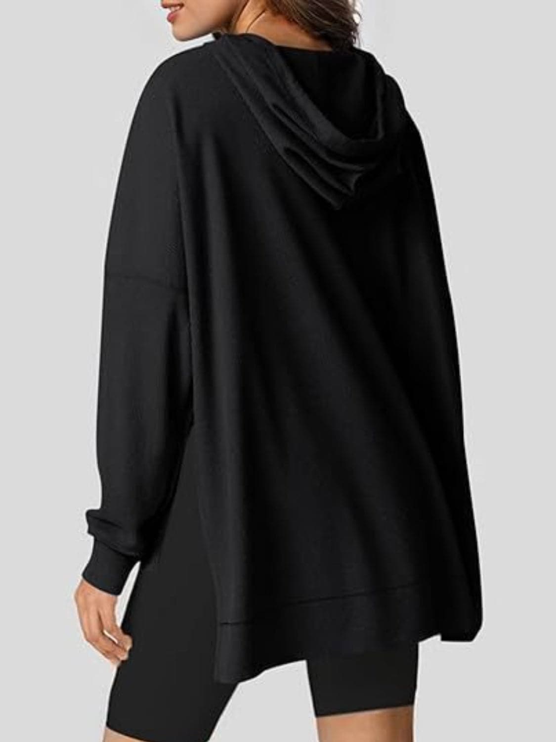 Sleek pocketed hoodie with drawstring and side slit