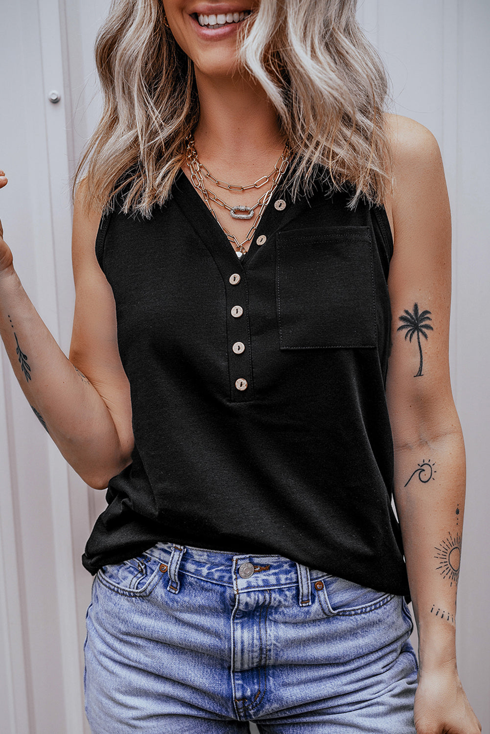 Chic black v-neck tank top with half buttons and patched pocket