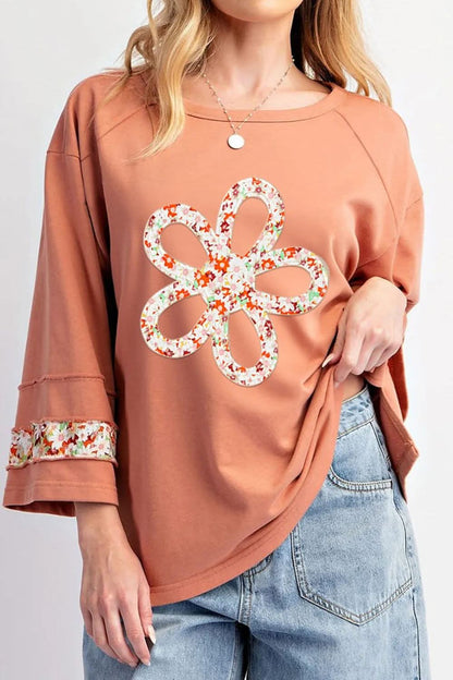 Floral round neck blouse with exposed seams and slits