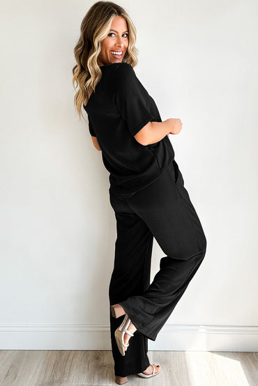 Chic black solid color t-shirt and wide-leg pants ensemble