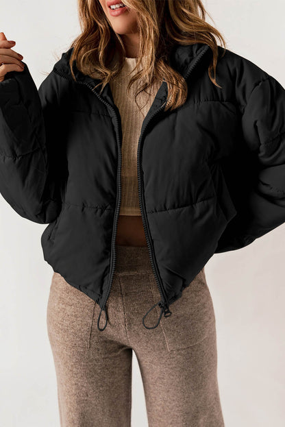 Sleek black puffer coat with zip closure and drawstring hem